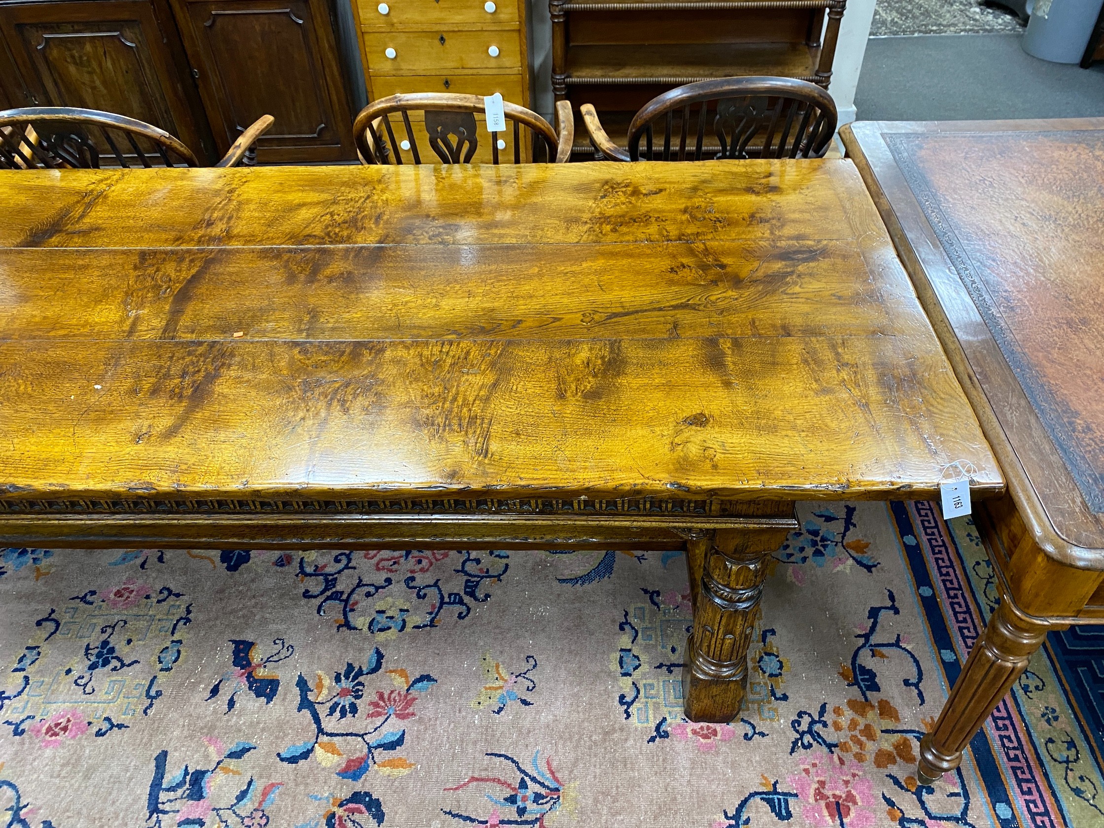 An 18th century style rectangular pale oak refectory dining table with central stretcher and two detachable extending leaves, (lacking three bolts) length 244cm, width 91cm, height 75cm, extending leaves each 46cm